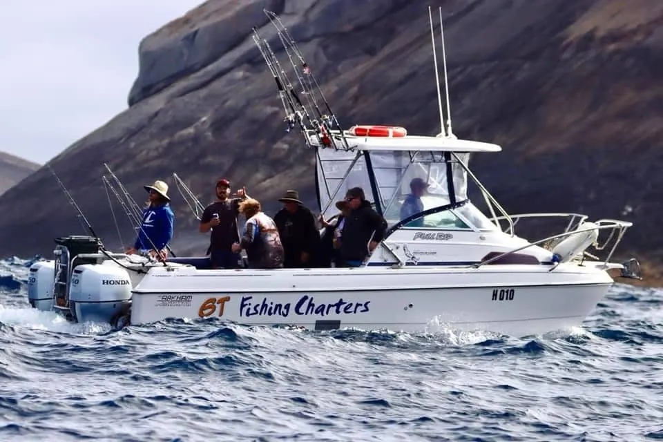 Full Rip, the GT Fishing Charters twin hull cat, with guests fishing off Coffin Bay
